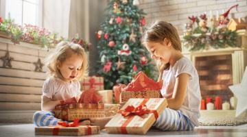 Girls opening gifts