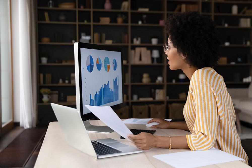 Studying research charts on a computer screen with laptop