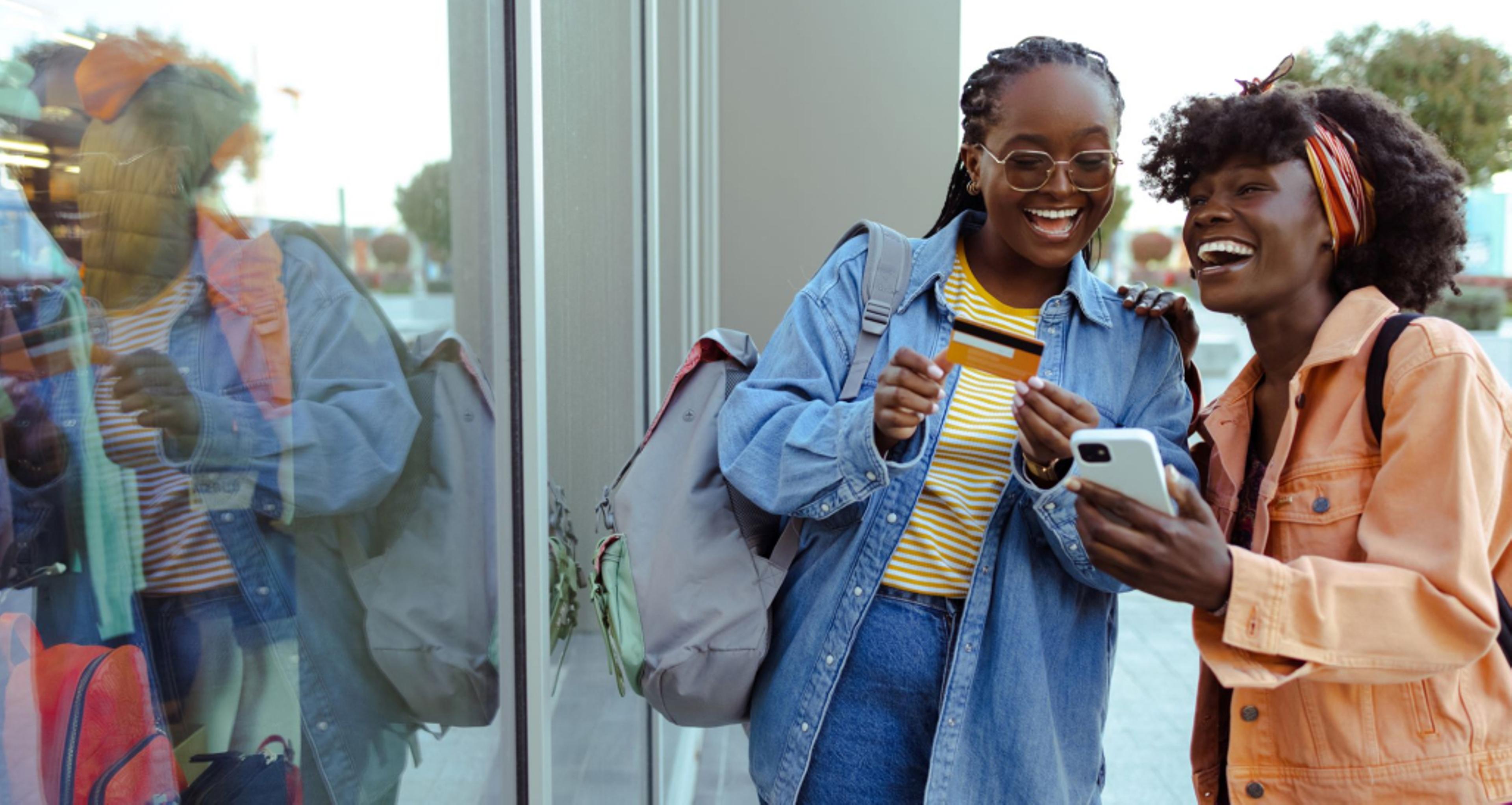 Women shopping with their phones.