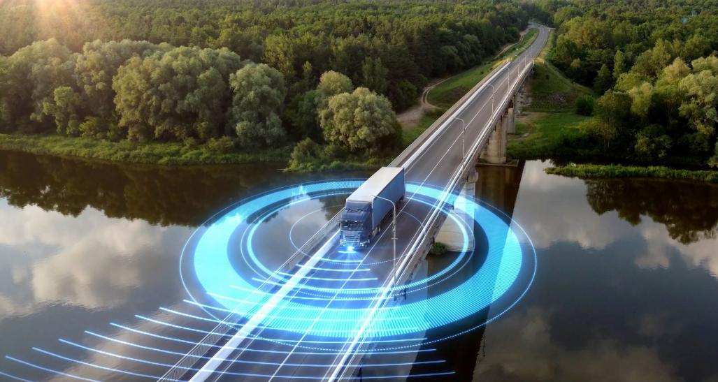 Delivery truck crossing a bridge.