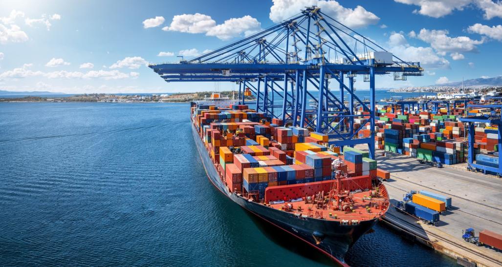 A container ship at a port with many shipping containers.