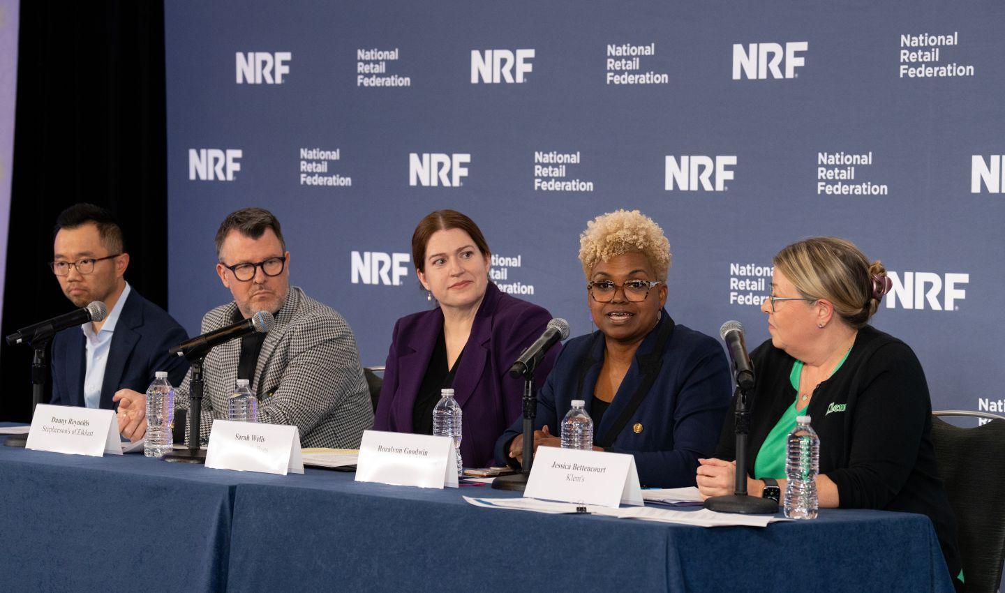 Small business owners sitting on a panel.