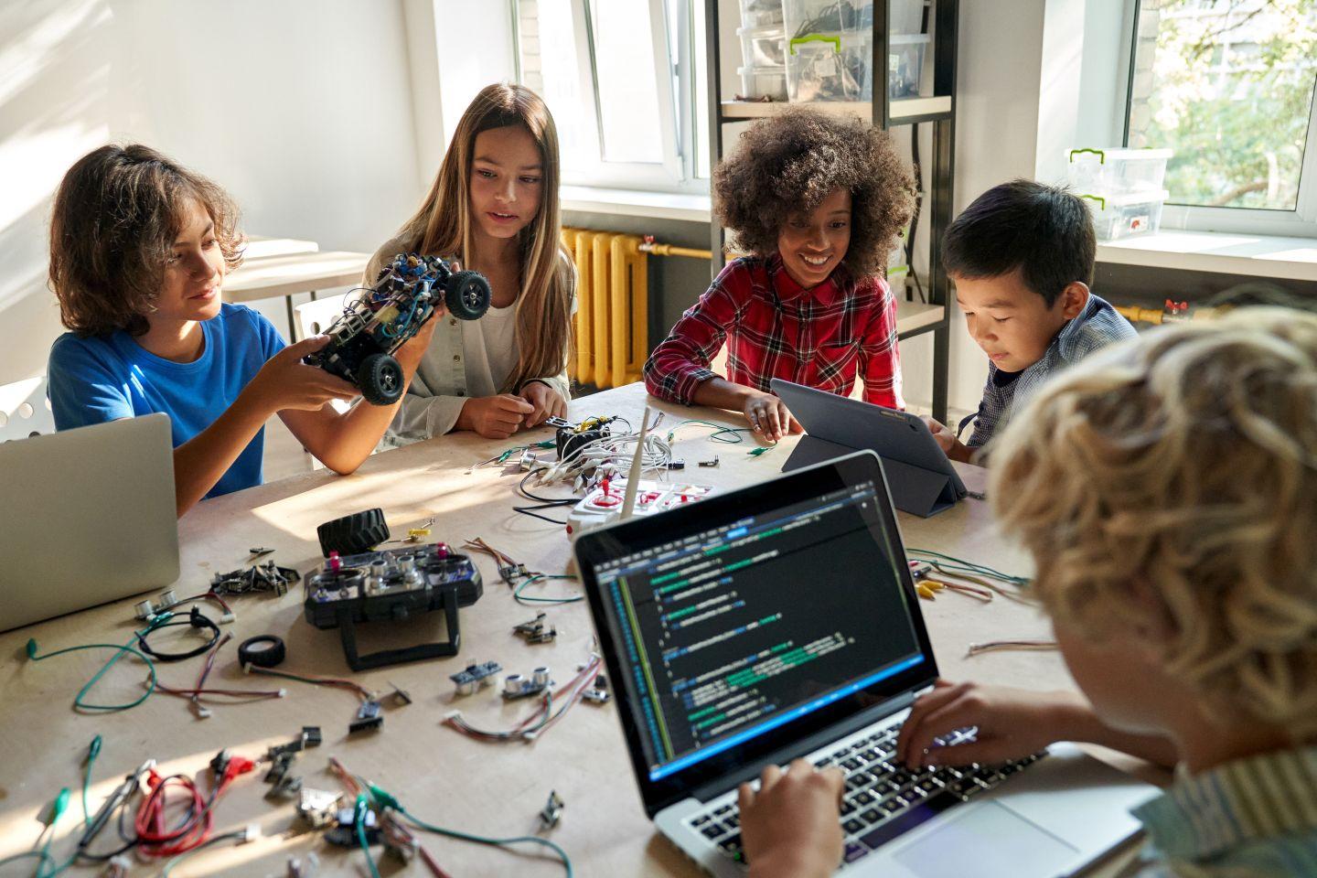 Kids working with technology.