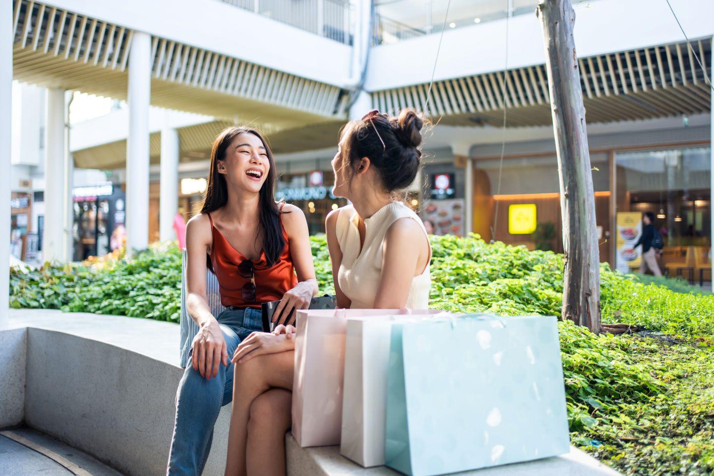 Friends chatting while shopping.