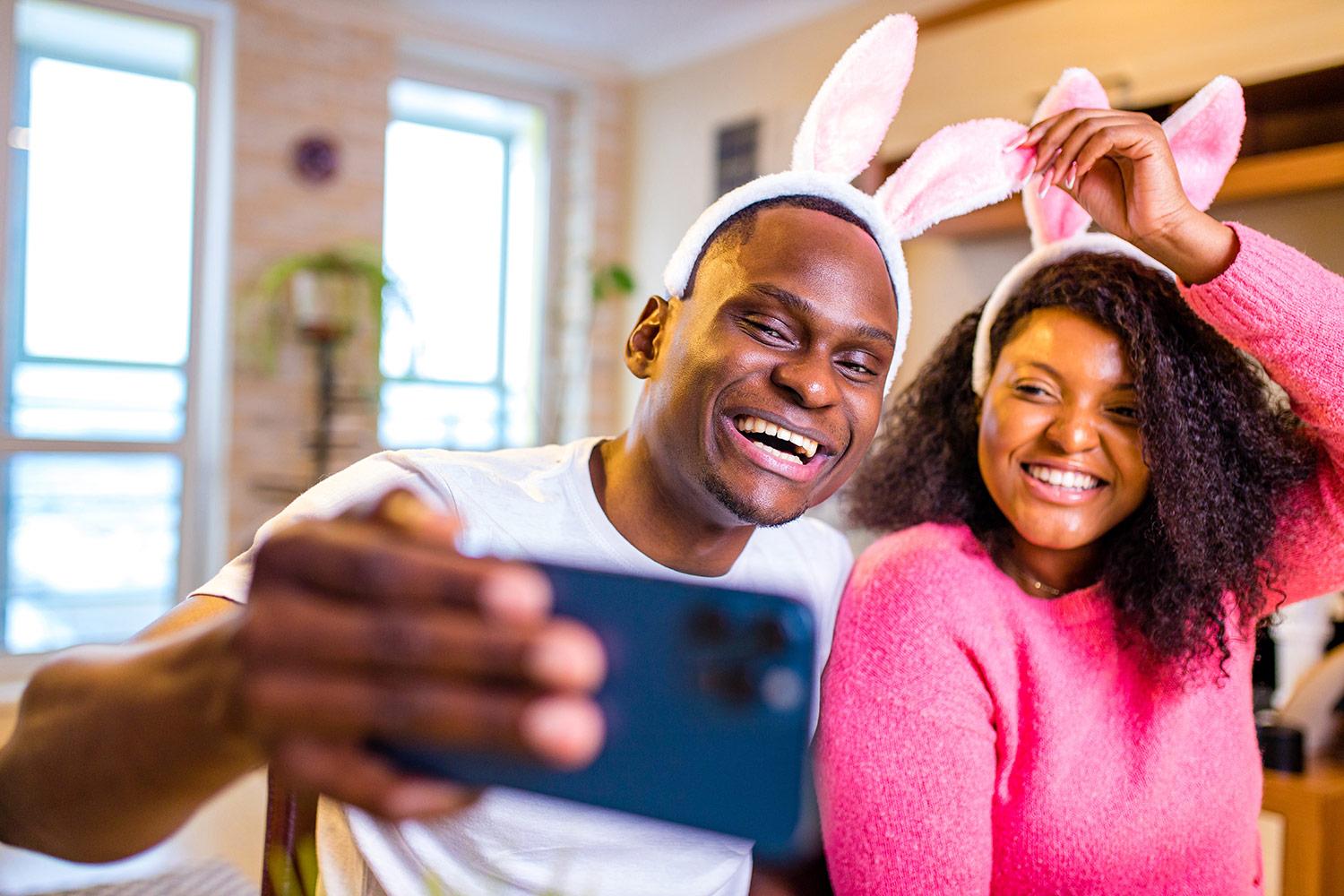 A couple wearing Easter bunny ears