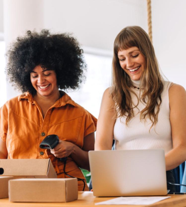 Retail workers scanning boxes.