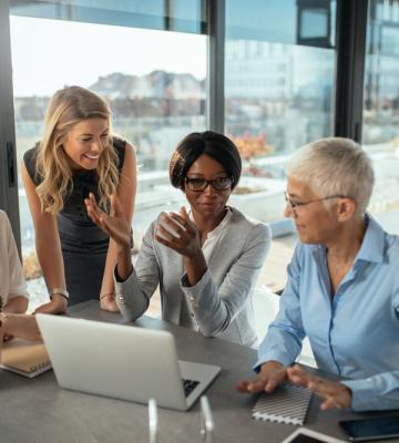 Professional women in a meeting.