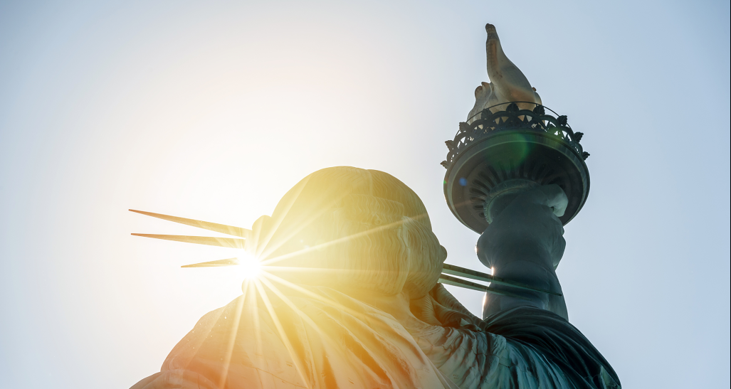 sun flare at the statue of liberty