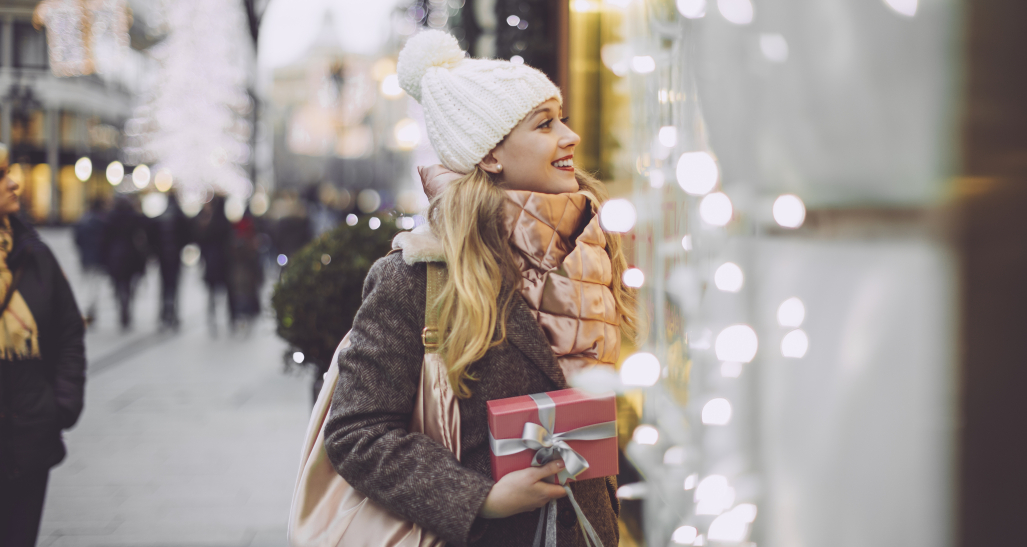 Woman window shops during holidays