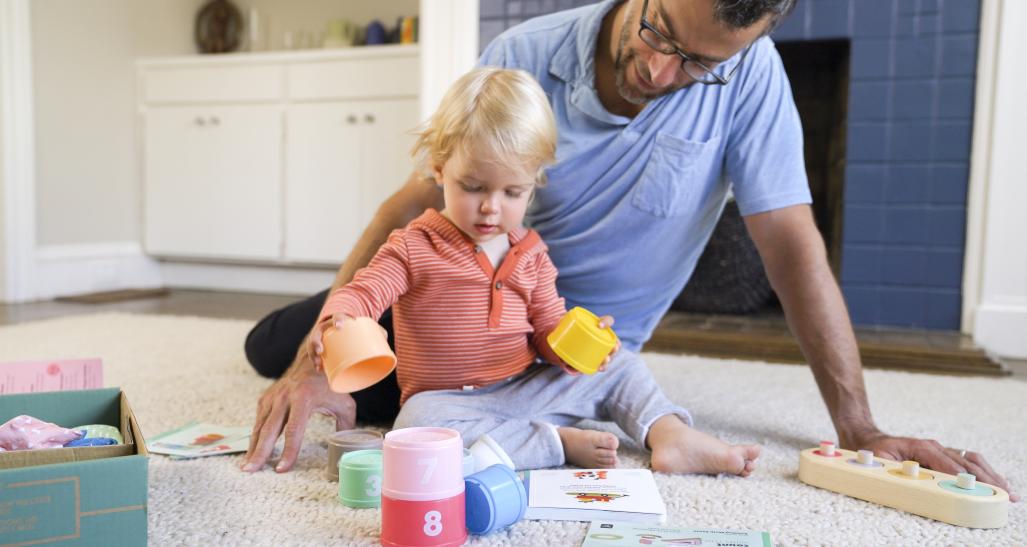 Child and and father play with Panda Crate