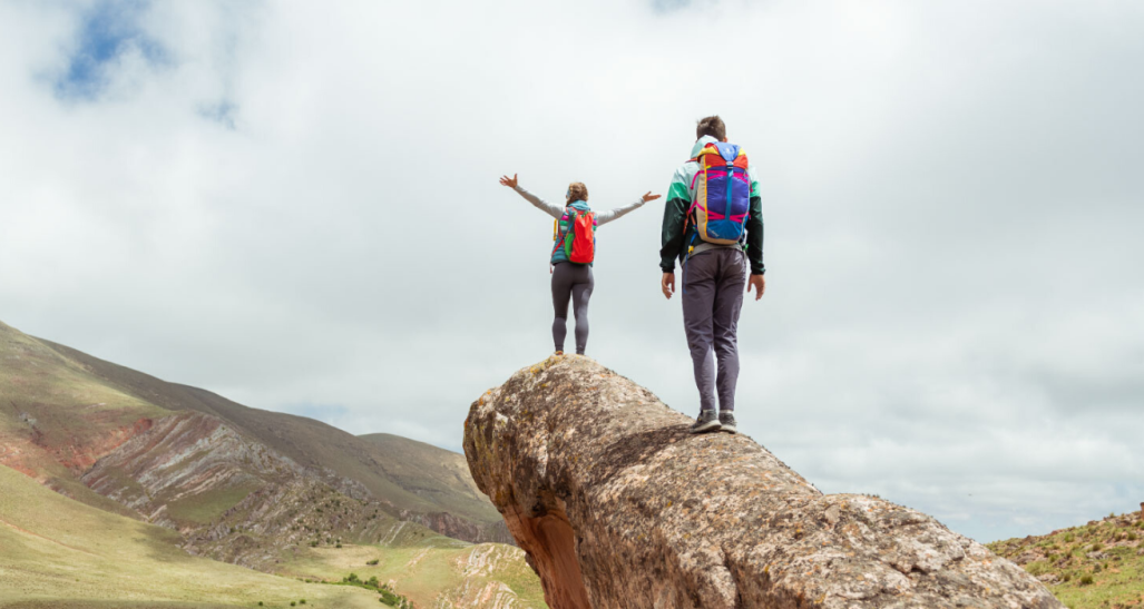 Two hikers wearing Cotopaxi gear