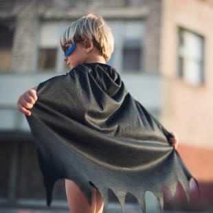 little boy in a batman halloween costume