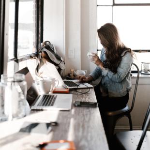 girl on computer in a coffee shop