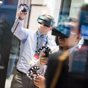 NRF 2019 Expo Hall two attendees testing AR-VR