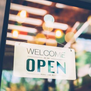 Photo of open sign on shop door