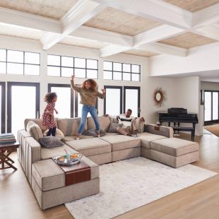 Family jumps on a Lovesac sofa